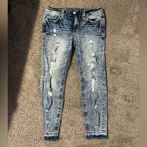 Ankle length distressed rock revival jeans from buckle